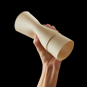 a person holding a sheet of Caverna filament
